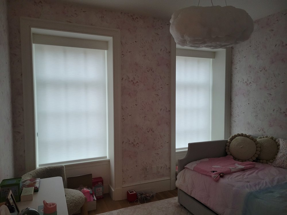 Bedroom in active development or staging phase showing mixed finish states. Walls are covered in a textured,