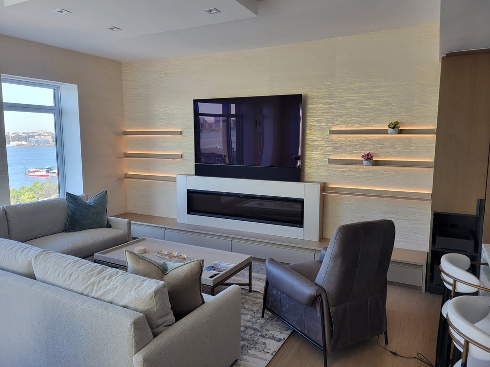A professionally designed media room with dedicated audio-visual systems and optimized lighting control. Dark