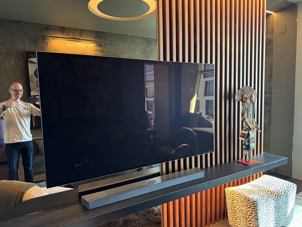 Another view of the contemporary media room from slightly different angle, emphasizing the large flat-screen