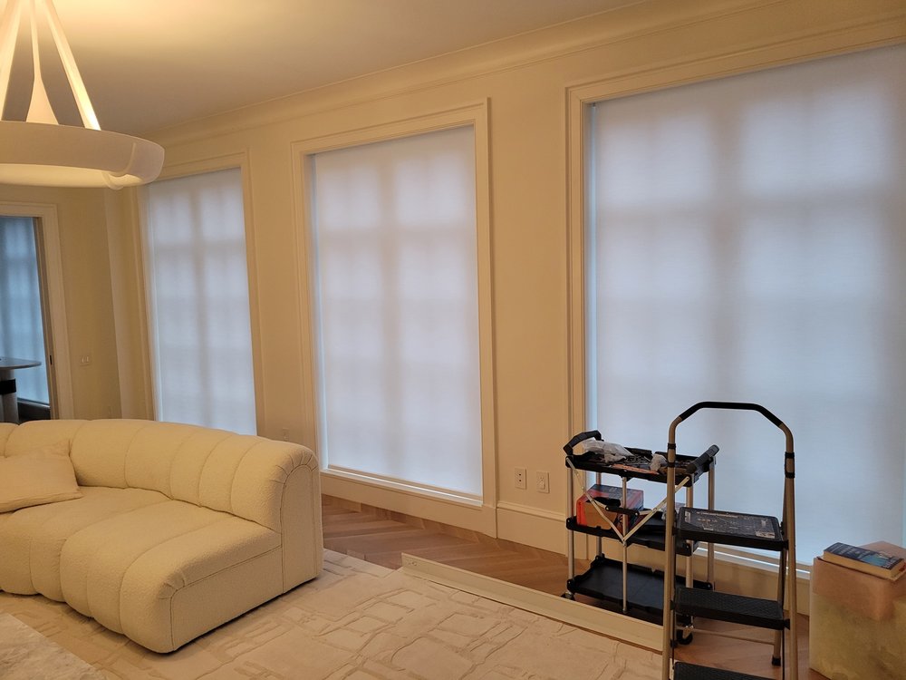 Modern living room in completed or near-completed finish state, showcasing integrated window control and