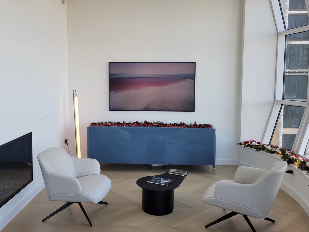 Home theater or media room in active construction/installation phase. The space features multiple large dark