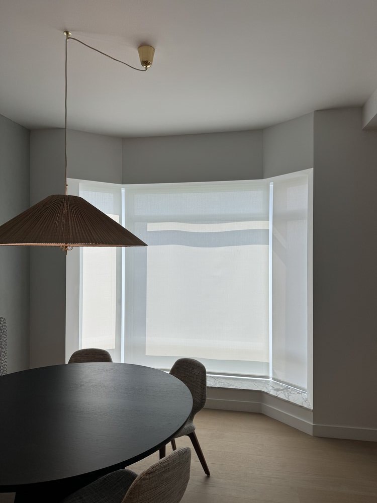 A well-appointed media room with finished interior design and integrated smart home technology. The space