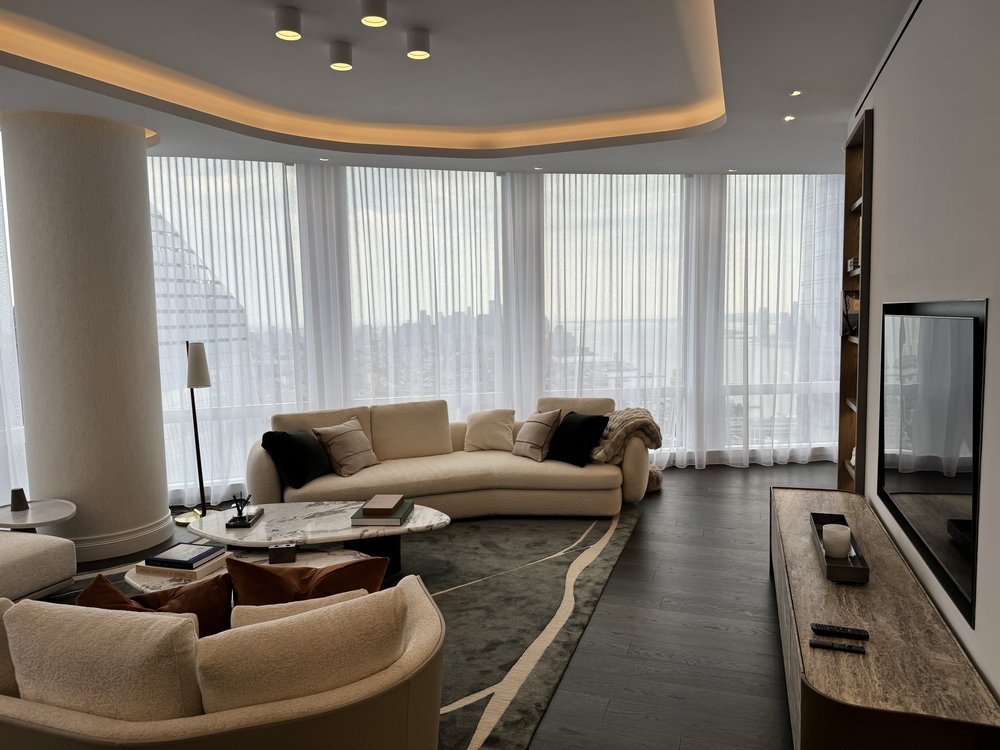 A professionally finished home theater space showcasing high-end audio/visual installation. The room features