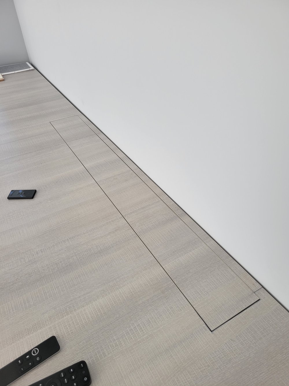 An elegant transitional space showcasing smart home lighting integration and contemporary design. The hallway