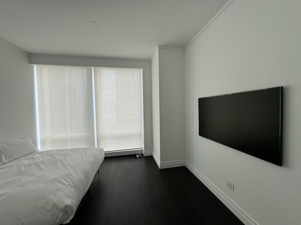 Ultra-premium high-rise residential penthouse featuring floor-to-ceiling windows with unobstructed Manhattan